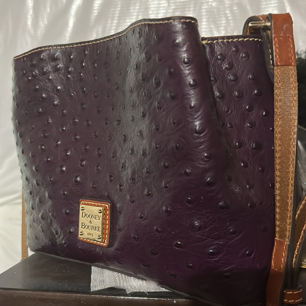 purple Dooney  Barlow, mini, ostrich, 3 flaws, 2 spots on strap,ink spot inside